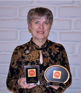 Author Loretta Hall with awards for Space Pioneers